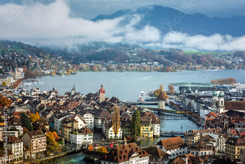 Lucerne city on Lake Lucerne and the misty Alps mountains, Switzerland