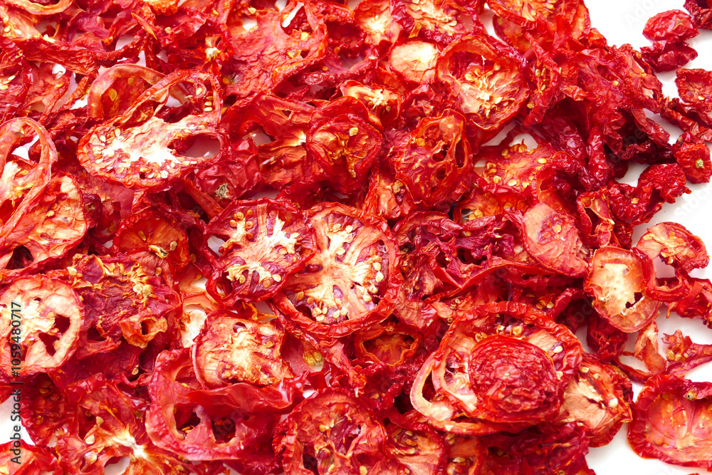 drying tomatoes in the sun, finely chopped tomatoes are dried on the balcony,
