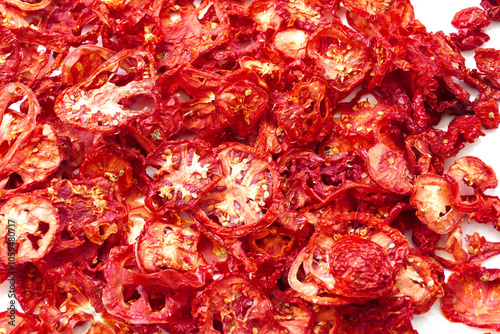 drying tomatoes in the sun, finely chopped tomatoes are dried on the balcony,