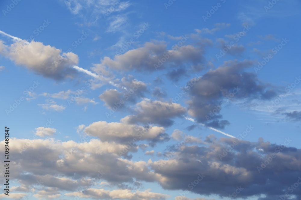 The white cloud trail left by the passenger plane in the sky