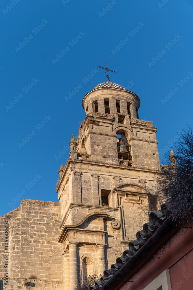 Naklejka premium Walking in old part of Jerez de la Frontera, Sherry wine making town, Andalusia, Spain in summer, architectural details, Andalusian style, churches and towers