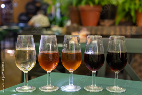 Flight of five sherry wine from barrels, fino, manzanilla, olorosso, amontillado, pedro ximenez jerez wines in old tavern, wine tasting, Sanlucar de Barrameda, Cadiz, Andalusia, Spain