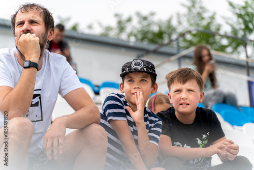 father and sons soccer sports fans photo