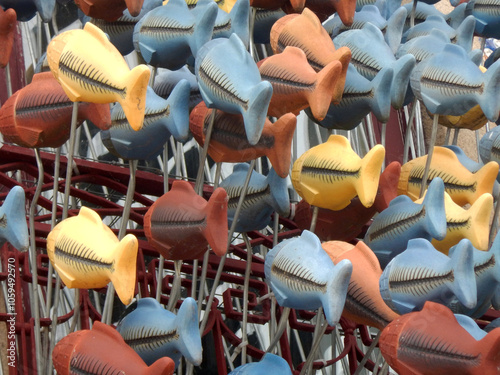 Hanging goldfish fleeing in the same direction