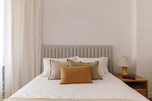 Wallpaper Mural A neatly made bed with multiple pillows Torontodigital.ca