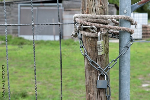 Padlock combination lock with chain on the fence