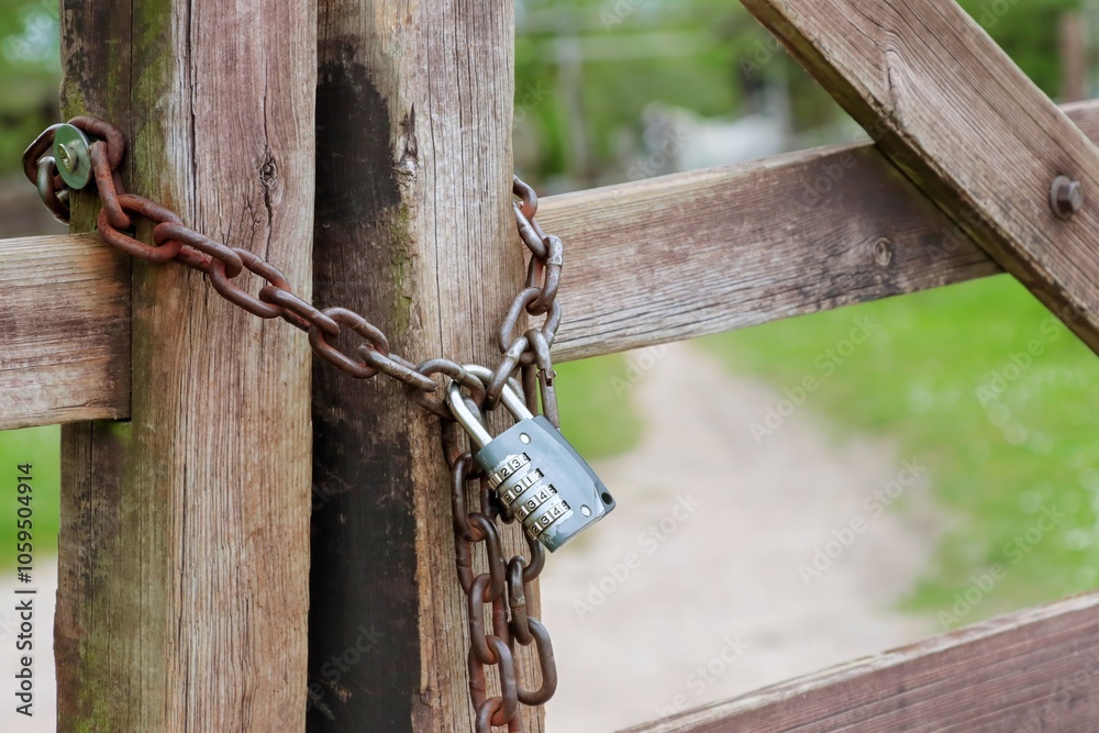 Padlock combination lock with chain on the fence Padlock combination lock with chain on the fence