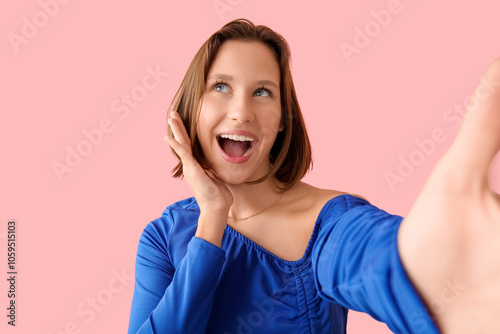 Pretty young woman taking s...