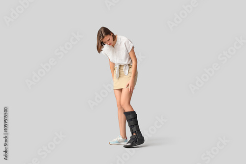 Young woman with broken leg...