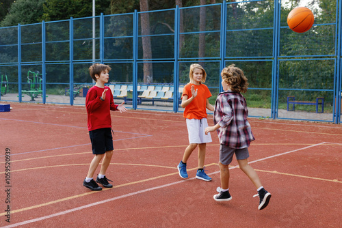 Boys high-fiving their friend after successful free throw during game photo