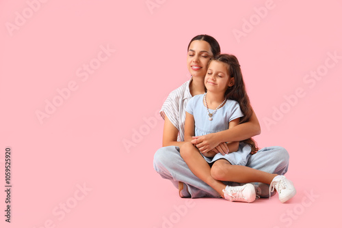 Embracing little girl with ...