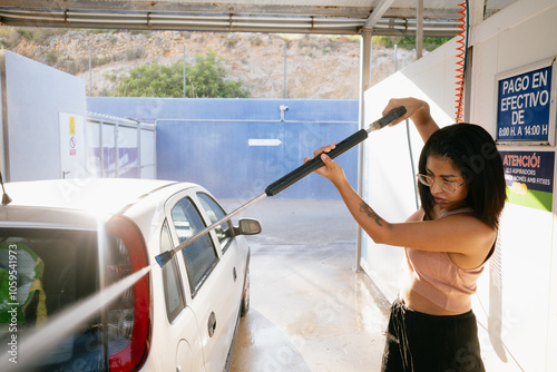 Woman Washing Car at Station photo