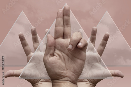 A group of hands  and  glass triangles photo