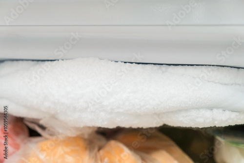 A lot of ice inside a fridge, freezer needs to be defrosted photo