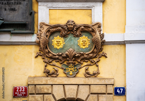 House sign with two suns on the House at the two suns (U Dvou sluncu), where Czech writer Jan Nerudalived, Nerudova 47, Mala Strana neighbourhood, Prague city center, Czechia photo