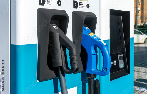 Konstfotografi Close up of ccs and chademo charger connectors in an EV electric vehicle fast charging station