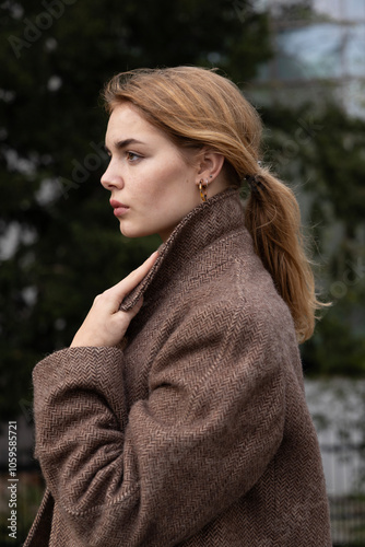  young woman in brown winter coat photo