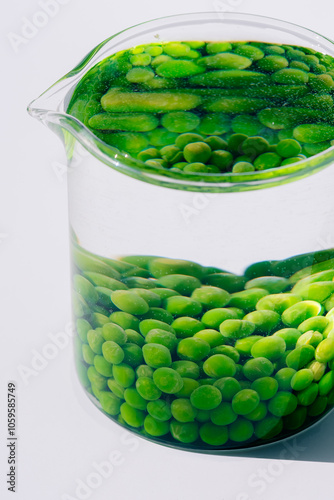 Green peas in a pitcher full of water  photo