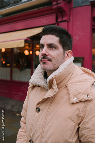 Man in Front of Red Storefront photo