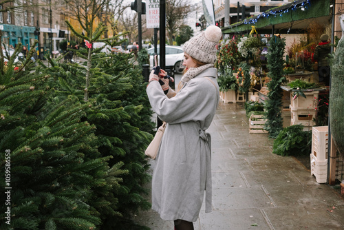 Woman taking a photo at Christmas market photo