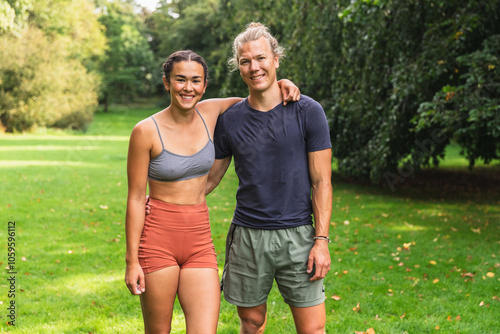 Happy Couple Exercising Together in Park