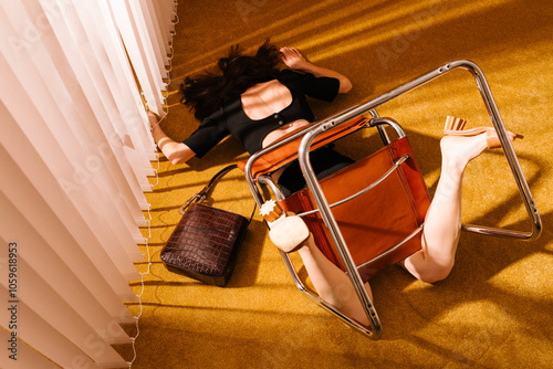Woman Tripping Over Chair in Living Room with Handbag