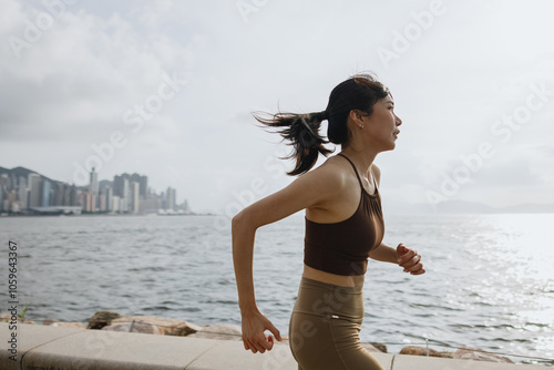 Woman running by the Waterfront