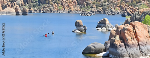 Kayaks on the waters of Watson Lake surrounded by the boulders of Granite Dells - Prescott, AZ.
