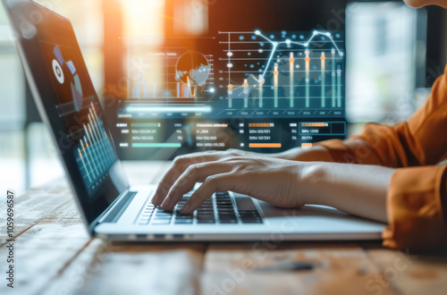 Businesswoman analyzing financial data with laptop and digital graphs