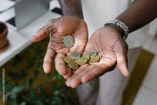 A man  with euro coins in his hands photo