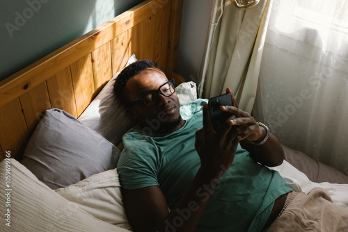 A man with a mobile phone writing a message photo