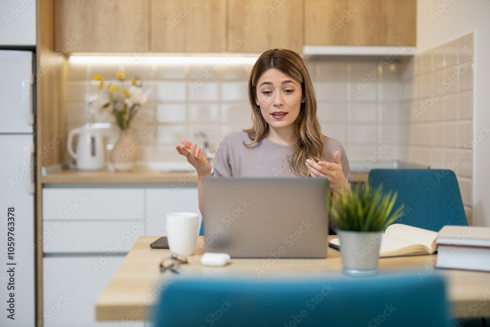 Woman Engaged in Online Meeting in Modern Home Kitchen Woman Engaged in Online Meeting in Modern Home Kitchen