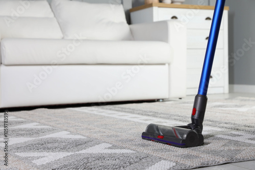 Wallpaper Mural Cleaning with wireless vacuum cleaner at home, closeup. Space for text Torontodigital.ca