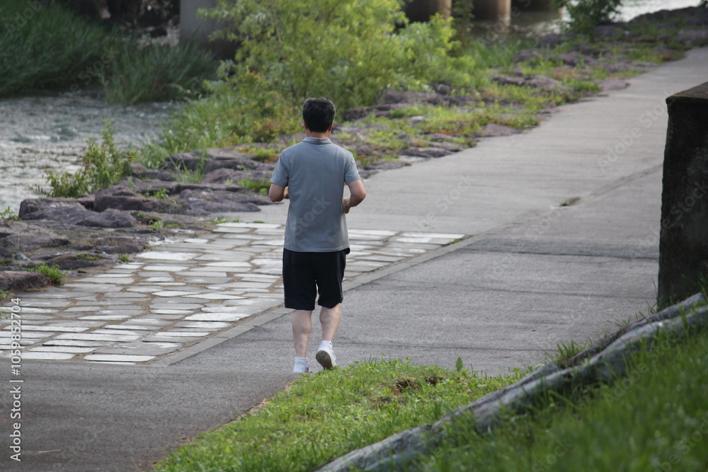 Fototapeta premium Image of a person jogging on the Daecheongcheon Trail