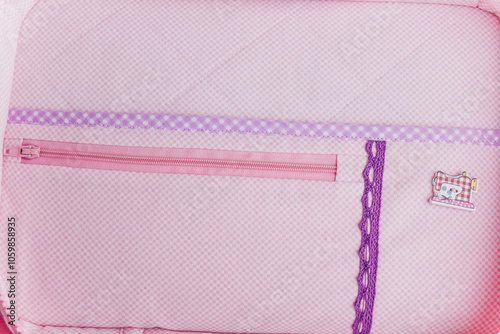 Organizer bag for storing needlework tools. Pink and purple bag with a handmade tag. Violet-pink soft fabric. photo