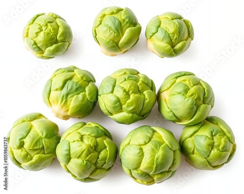 a close up of a group of green vegetables on a white surface. photo