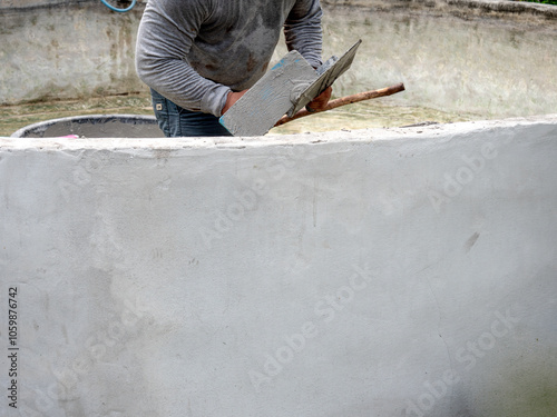 Worker was Plastering The Wall of The Well