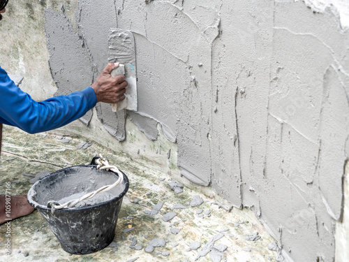 Worker was Plastering The Wall of The Well