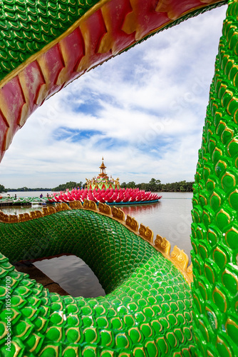 The Naga statue is located at the riverside viewpoint at saman temple (wat saman), chachoengsao, thailand photo