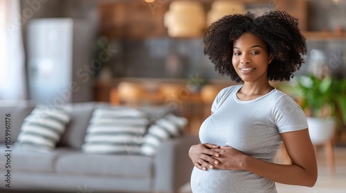 Happy Pregnant Woman at Home in Cozy Living Room photo