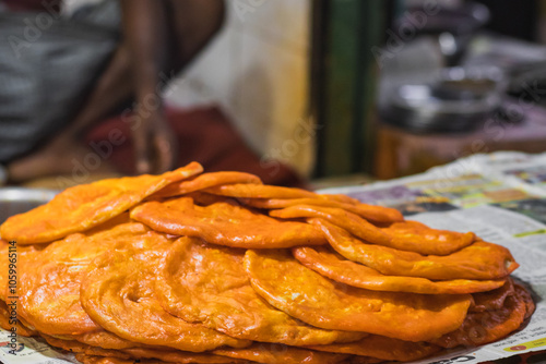 Sheermal or shirmal is a type of saffron flavoured paratha of orange color. It is traditional food of Iran and found in Lucknow india.  photo