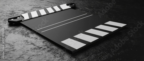 Close-up of a black clapperboard with white stripes on a dark background. photo