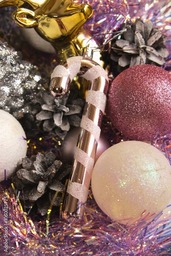 christmas new year pink glitter candy cane with christmas background. happy holidays. photo