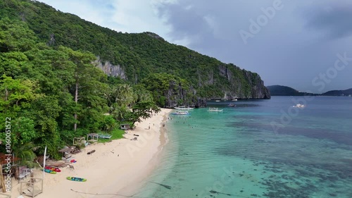 Stunning Drone Flyover of Beach with Pristine White Sand, Crystal Clear Water, and Boats in the Philippines – Sunny Skies in High-Resolution 4K