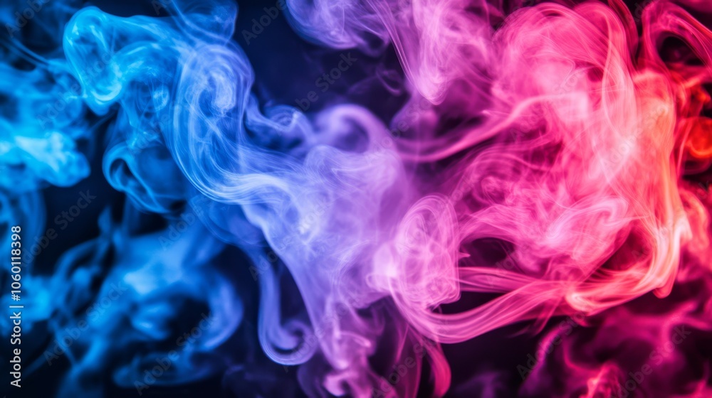 Obraz premium Abstract colorful smoke swirls on a black background.