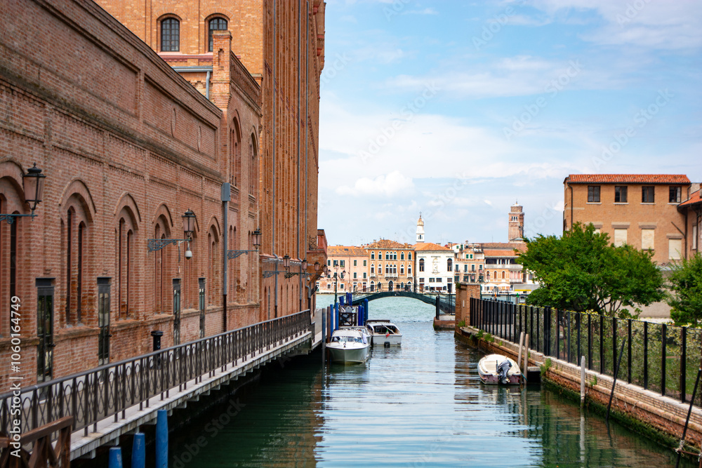 Naklejka premium Venice-la Giudeca: Unveil the magic of Venice by strolling through its intricate network of alleys, each one steeped in history and character