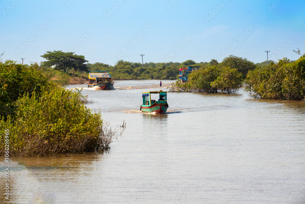 Boat on a lake in Cambodia going to floating village Boat on a lake in Cambodia going to floating village