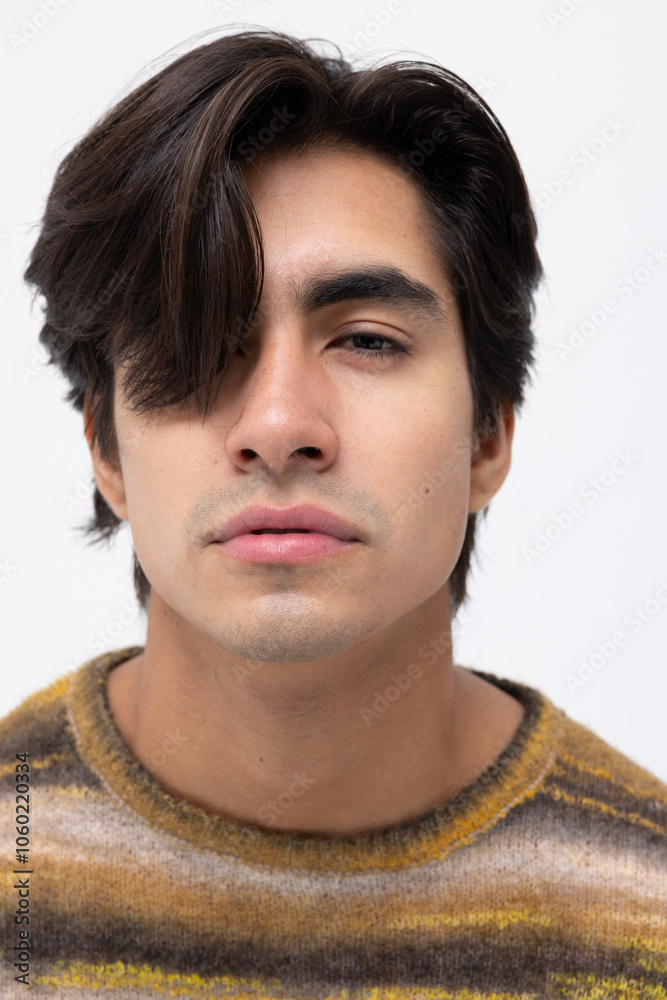 Obraz premium Headshot of young handsome man posing over white background. Vertical.