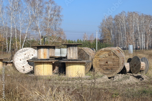 Wooden cable drums on an autumn day in the open air