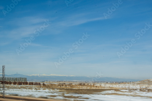 The snowy landscape rolls on endlessly, a serene sea of white under the big sky, Colorado, United States of America photo